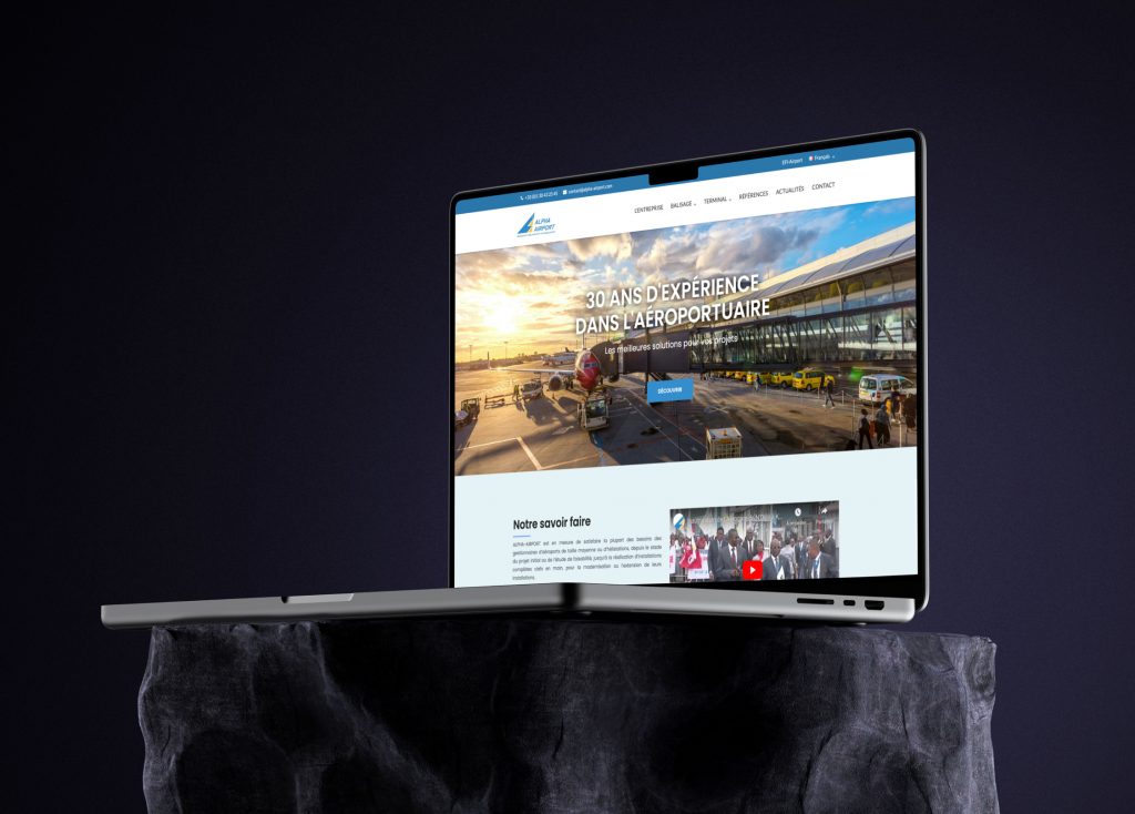 Free MacBook Pro mockup on stone pedestal (Mockuuups Studio)